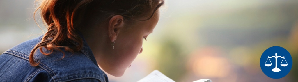 Child reading a book.