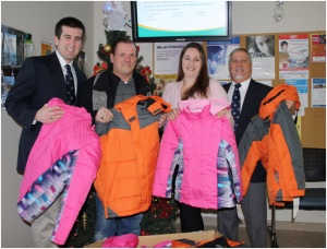 From left to right: Knights of Columbus members Sean Robertson (Recorder), Leo Chaumont (District Deputy 18), and Tony Sangiuliano (Grand Knight). Second from right: Brooke Ballantyne (Communications Coordinator, NEOFACS). 