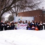 Group of peple with flag outside